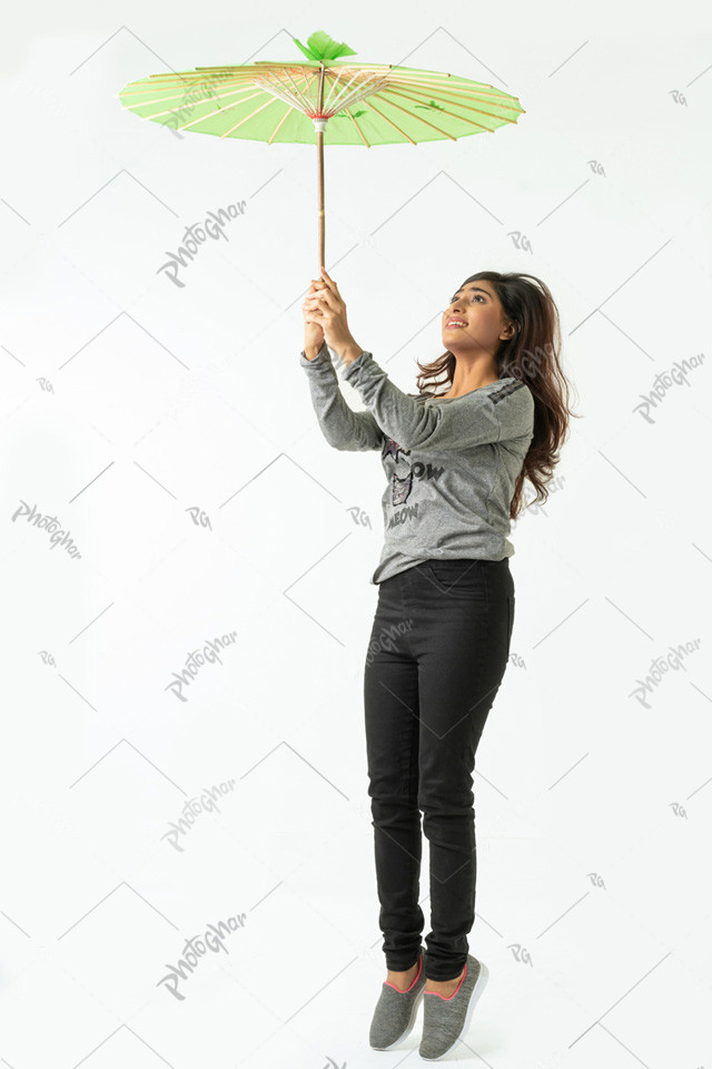 Smart happy woman jumps with parasol