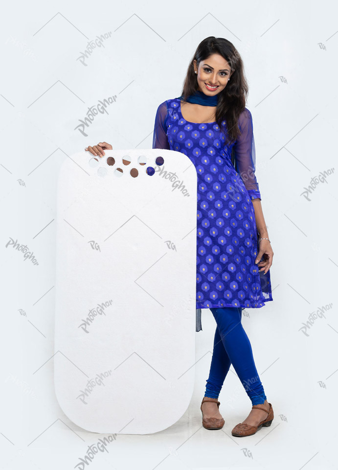 Smiling beautiful slim young girl holding blank board