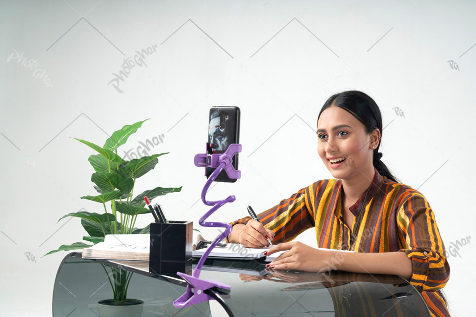 Smiling happy girl attending online classes