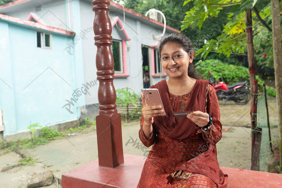 Smiling happy girl use internet banking