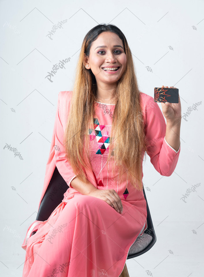 Smiling happy woman showing bank card