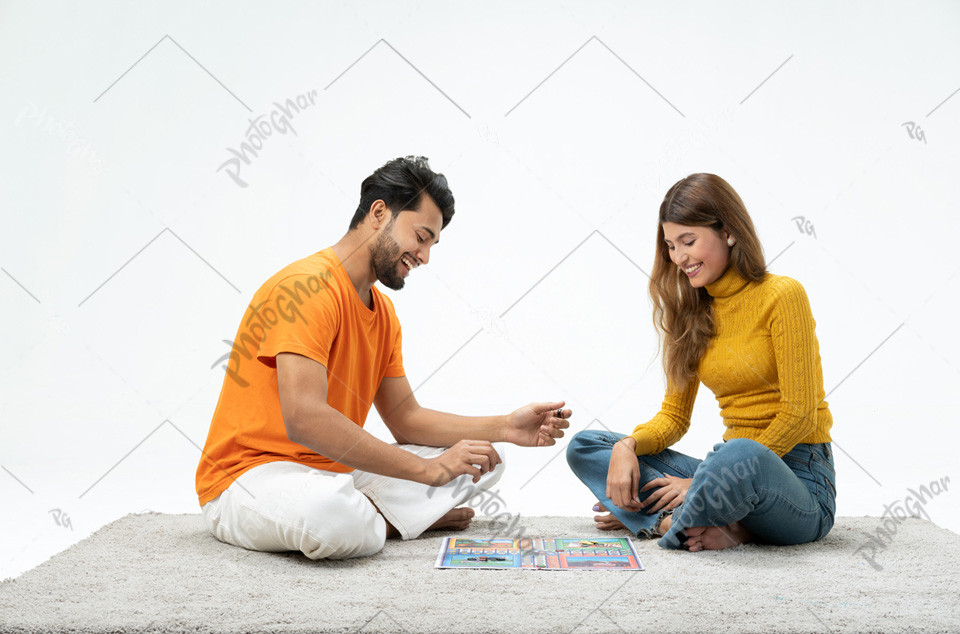 Smiling young couple playing game