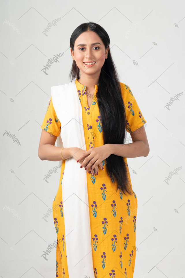 Smiling young woman standing straight