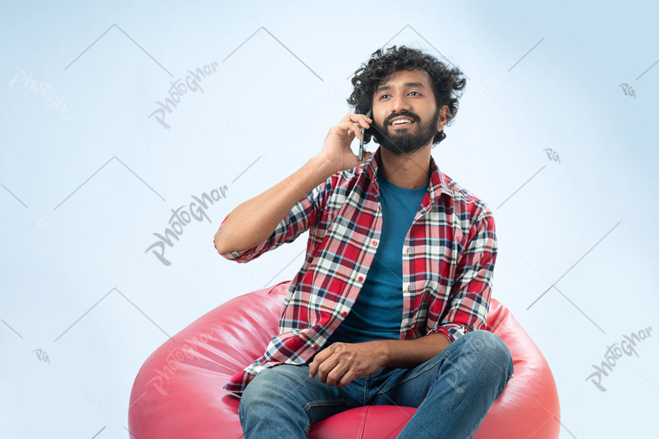 Stylish young man talking on phone