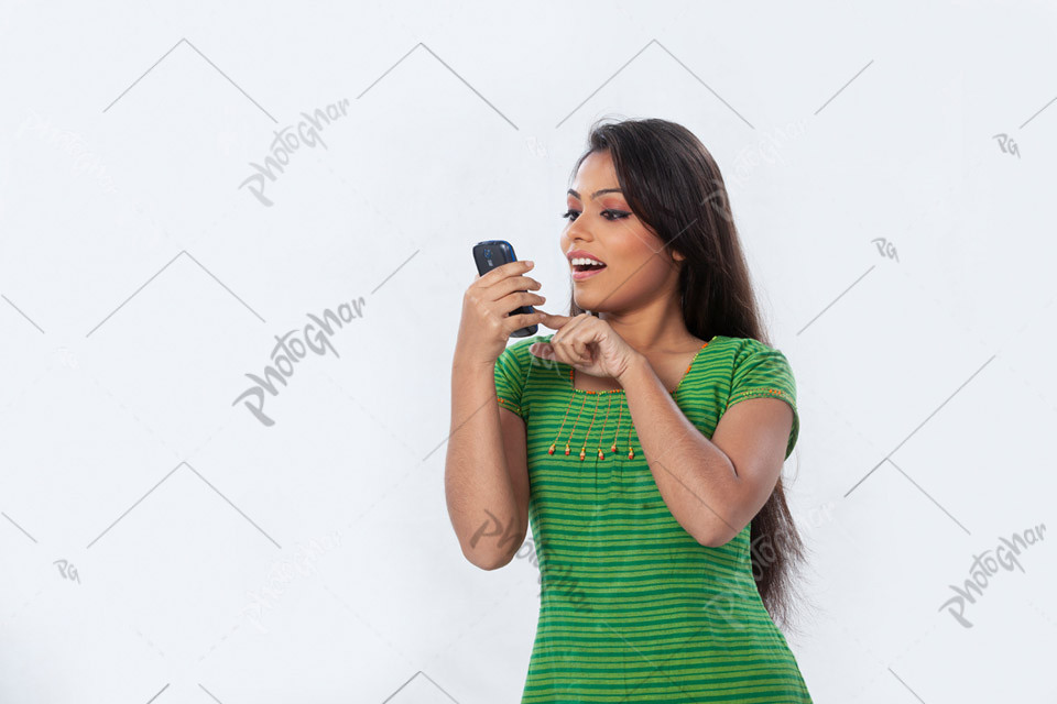 Surprise woman using mobile phone