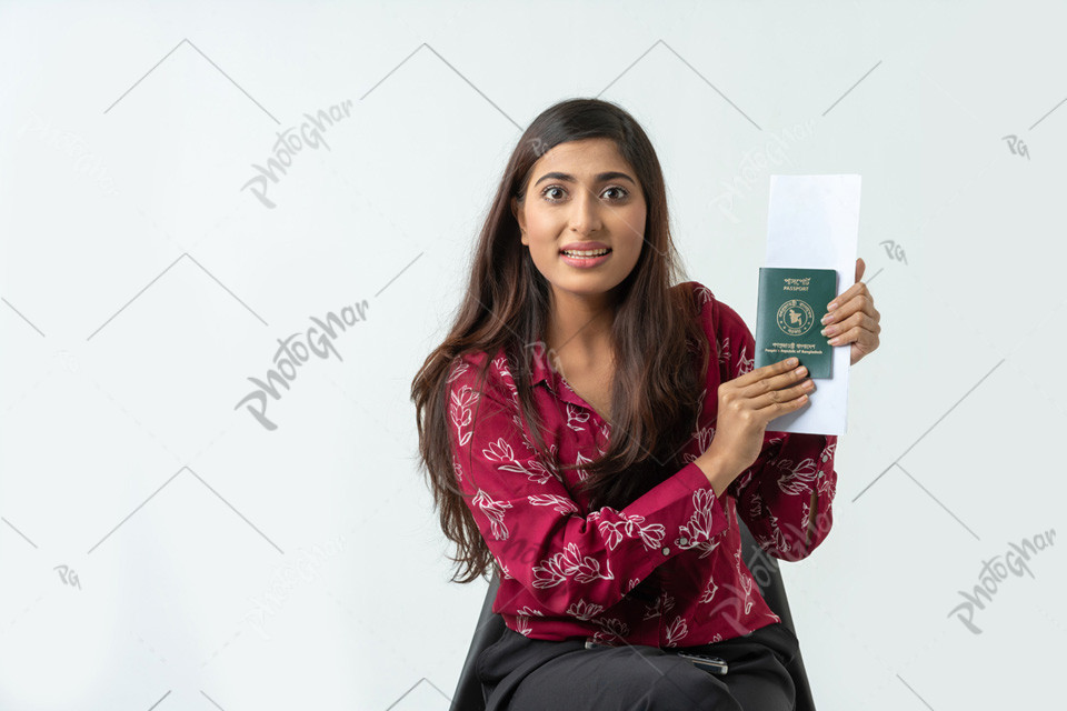 Surprised woman displays passport and travel documents