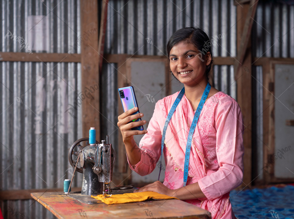 Village rural entrepreneur using sewing machine