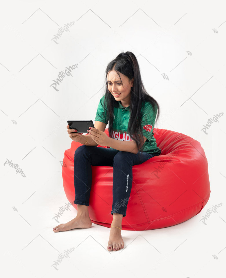 Woman cricket fan watching match on smartphone