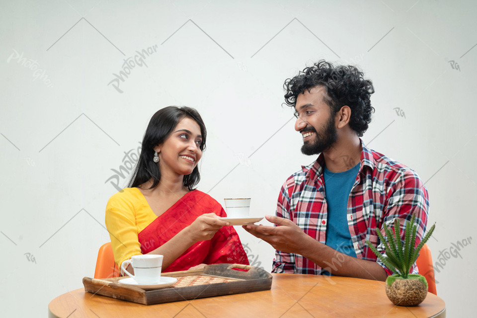 Woman giving cup tea boyfriend