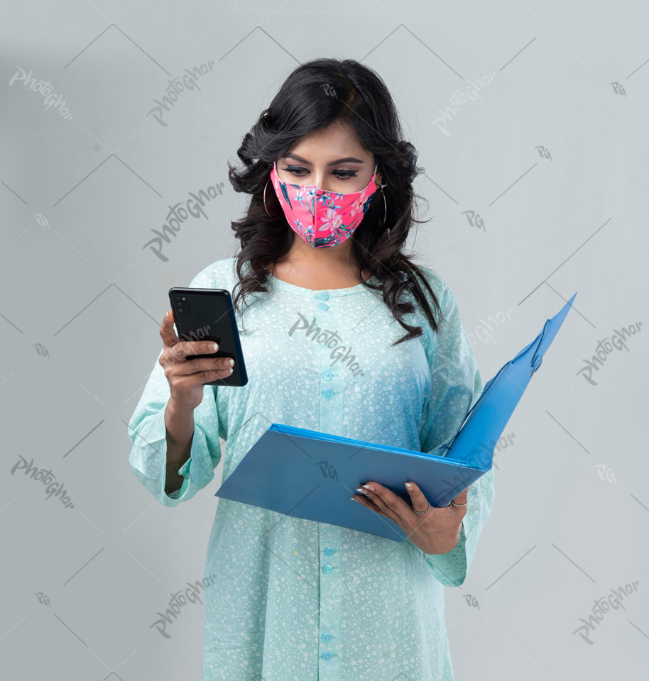 Woman holding phone and adiary