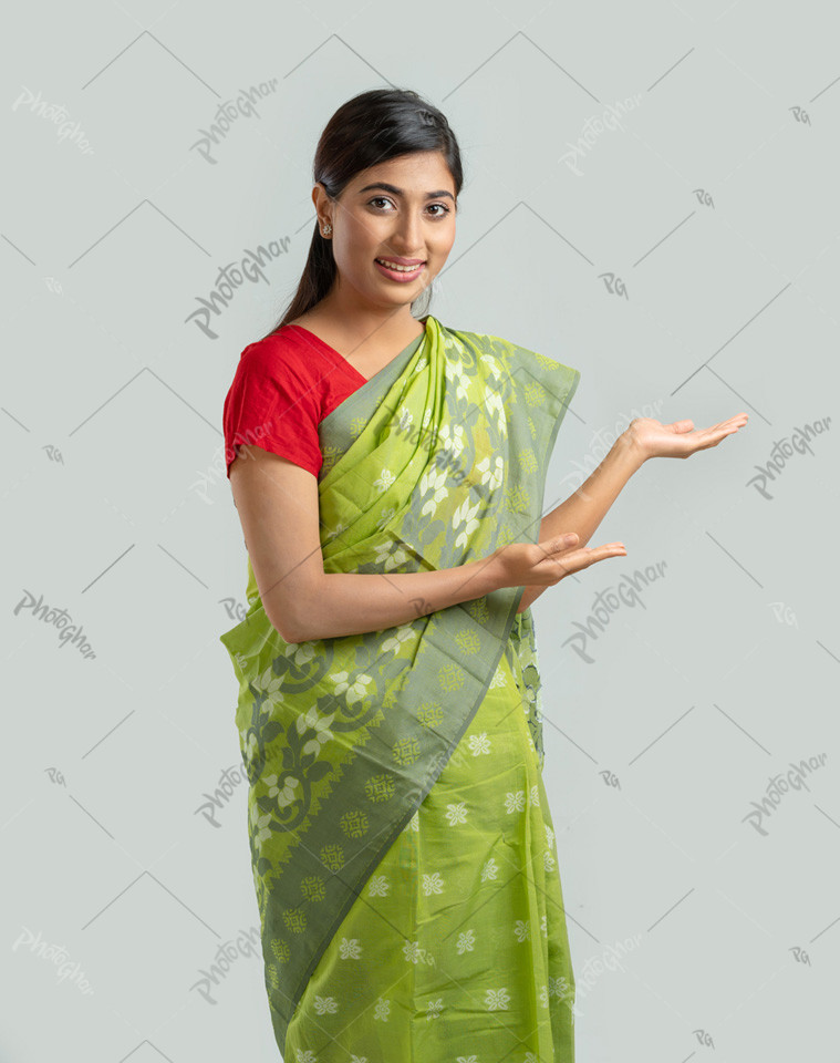 Woman in sharee pointing right