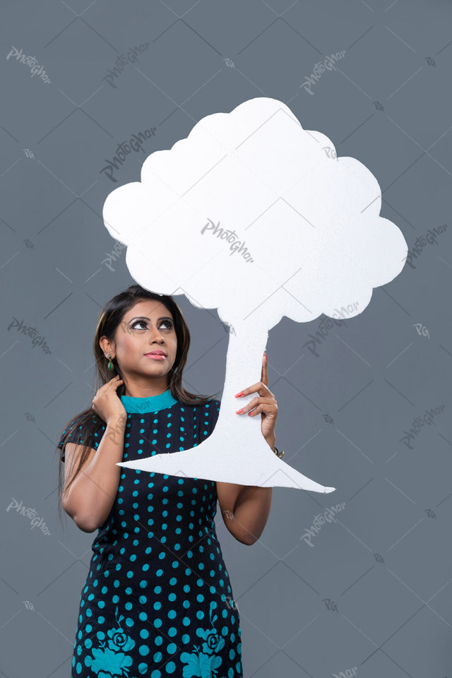 Woman showing empty tree cutout