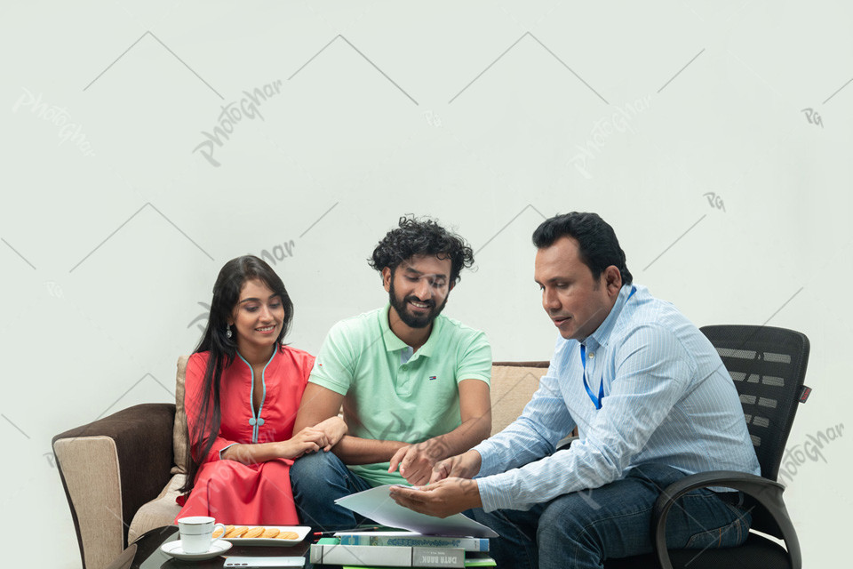 Young Couple Talking to Loan Officer