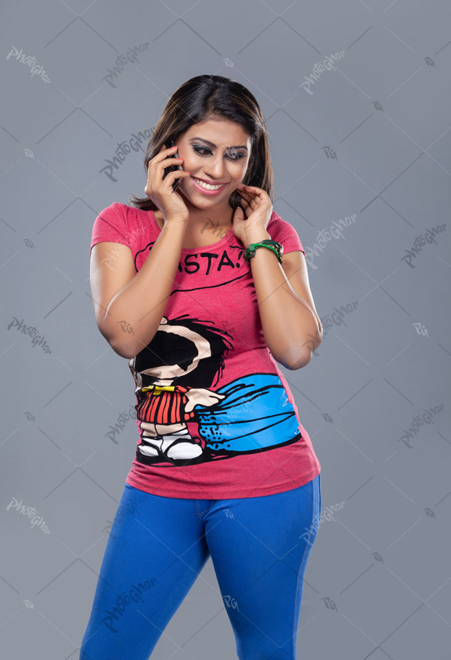 Young adult lady talking on smartphone