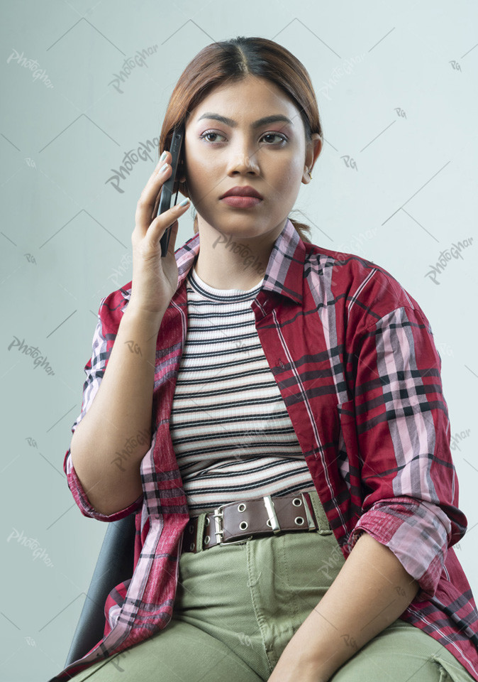 Young adult lady talking on smartphone