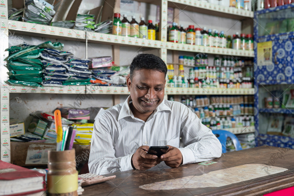 Young adult man selling pesticides, herbicides, quality seeds and fertilizers