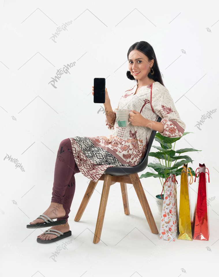 Young adult woman completing online payment