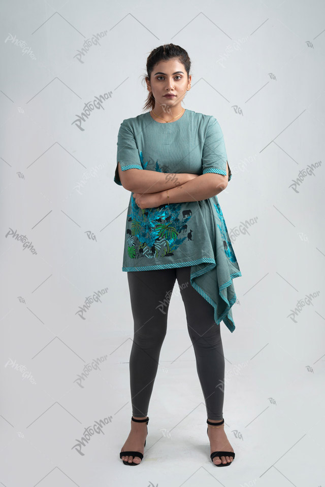 Young adult woman with arms crossed