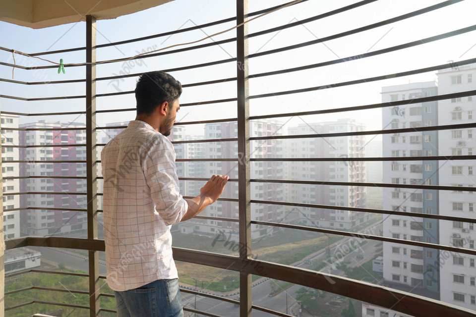 Young boy looking at the cityscape view in Bangladesh