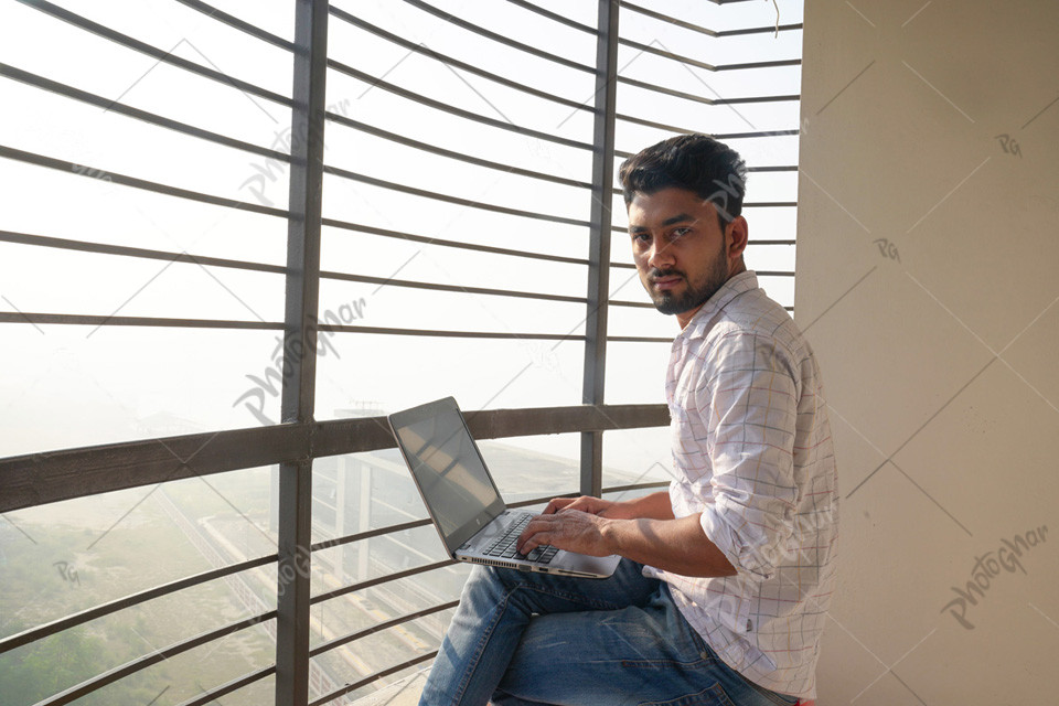 Young freelancer in Bangladesh working on a laptop