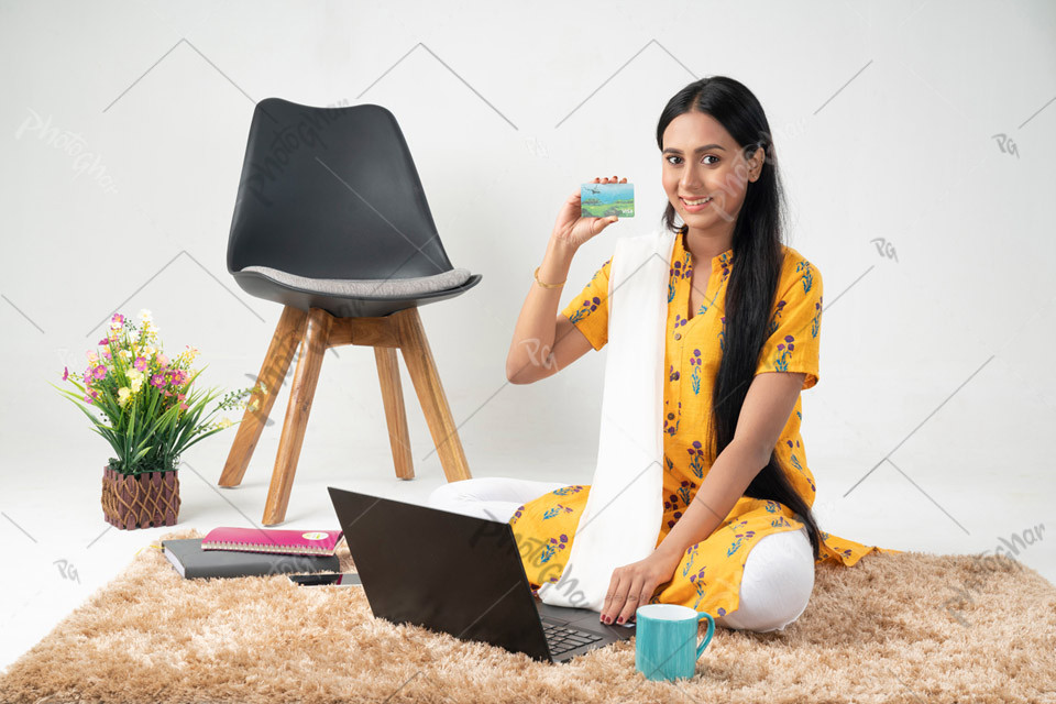 Young girl paying online using laptop computer