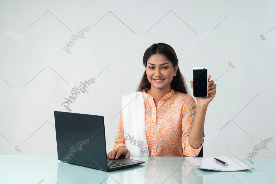 Young girl showing smartphone screen