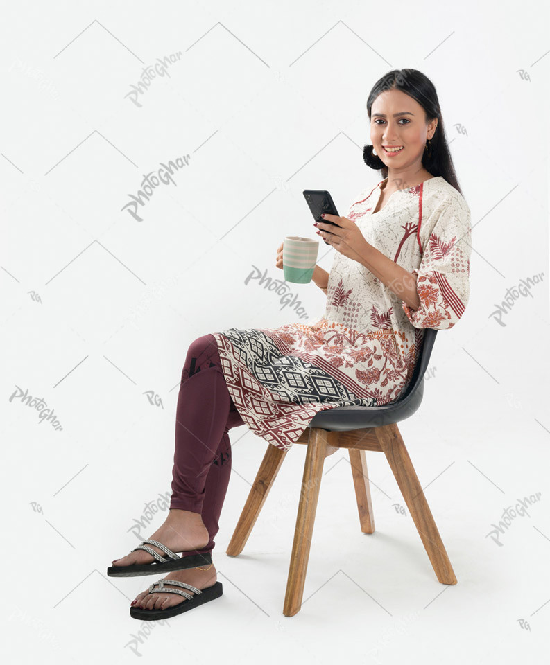 Young girl sitting on chair confidently