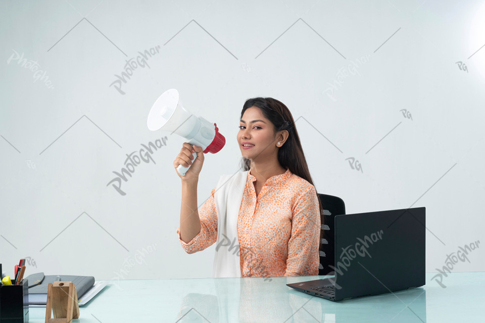 Young lady holding a megaphone