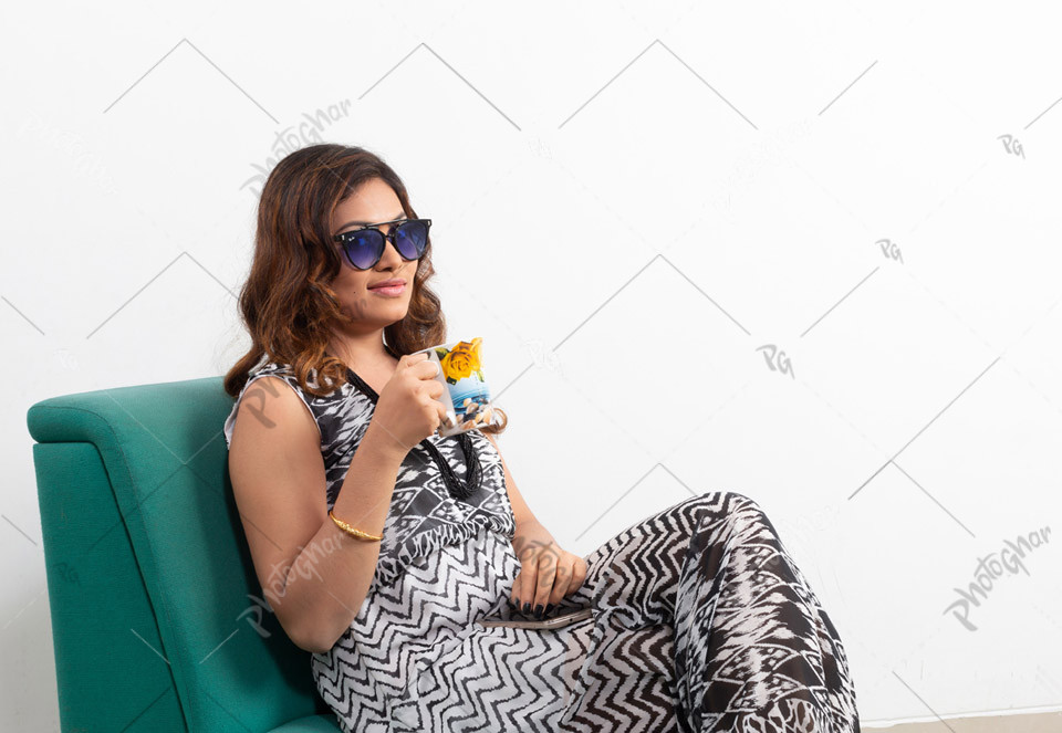 Young lady holding coffee mug