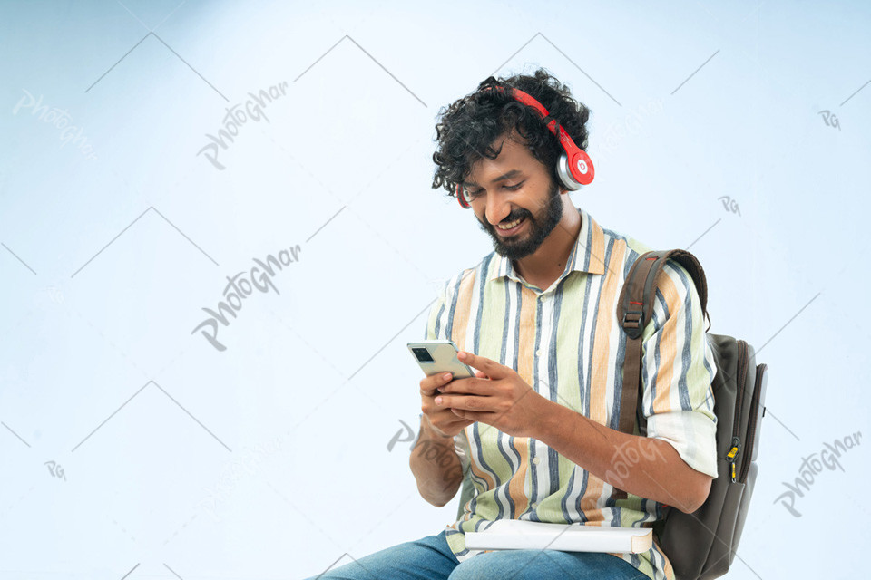 Young man student browsing phone