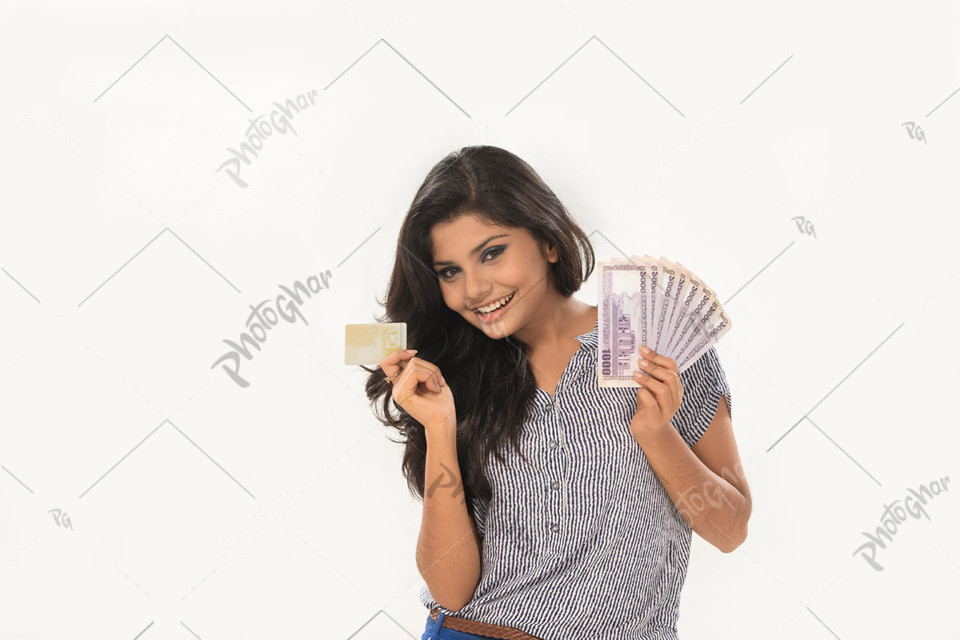 Young student cashing out mony, using card