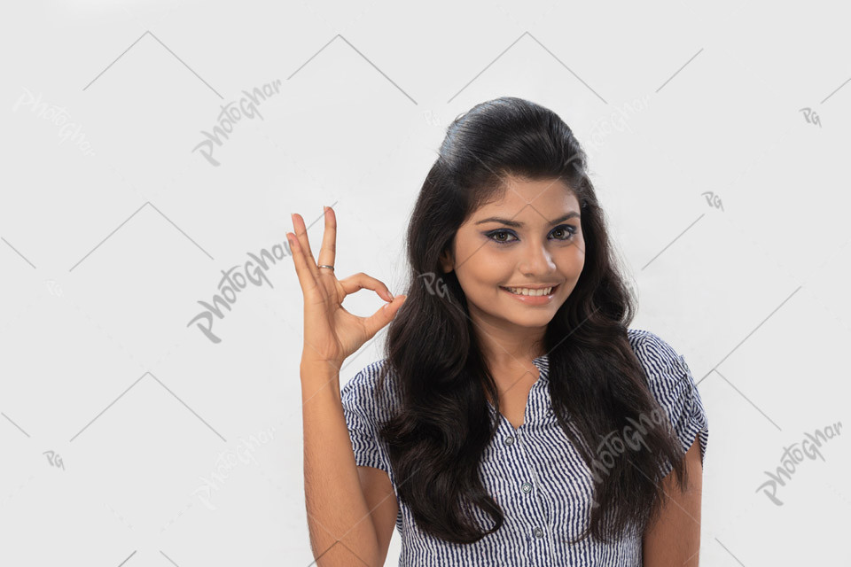 Young student displaying a tasty sign