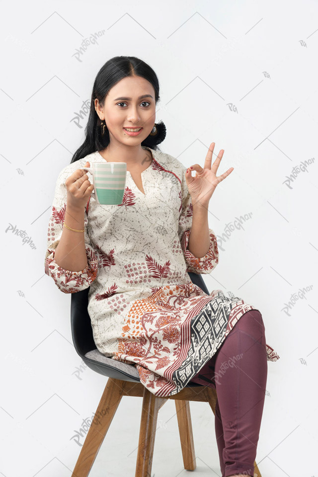 Young woman holding coffee cup