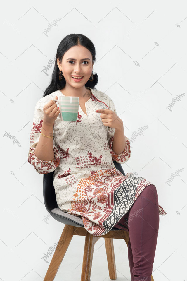 Young woman holding coffee cup