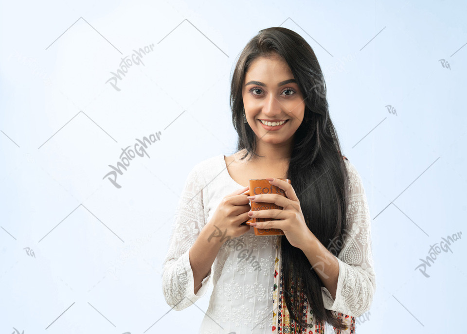 Young woman holding coffee mug