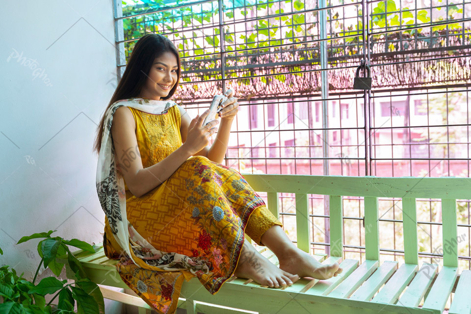 Young woman in balcony