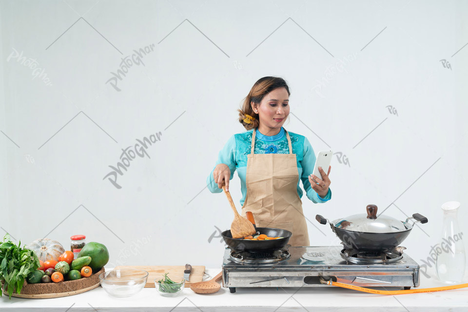 Young woman in kitchen apron