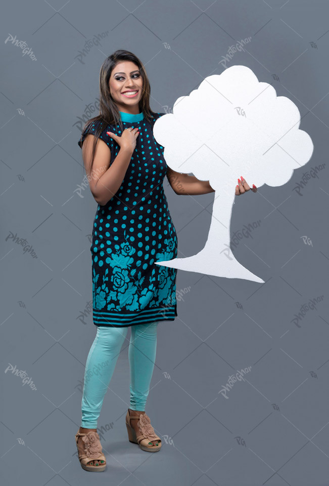 Young woman with tree cutout