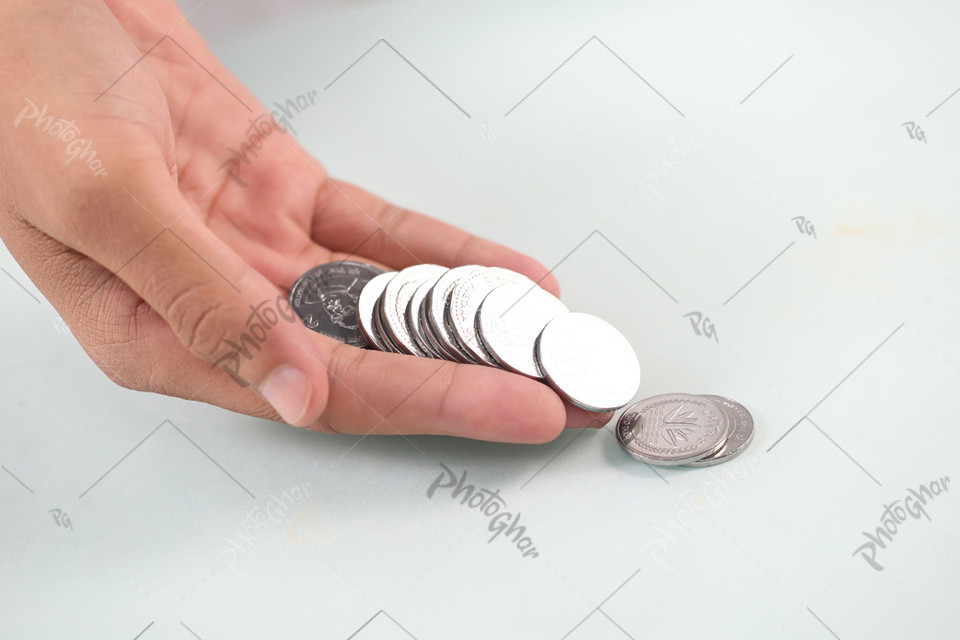 bangladeshi coins in hand