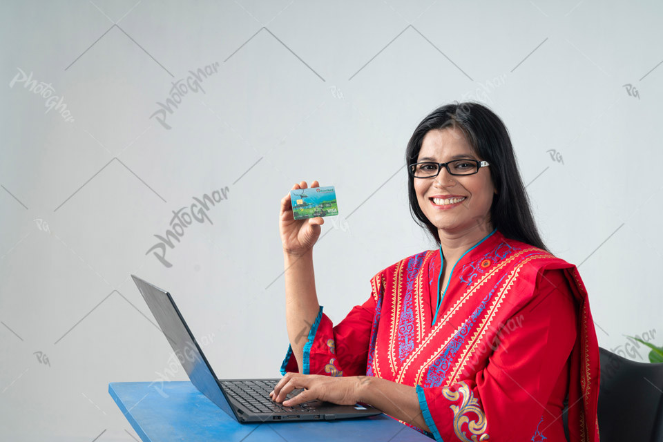 bangladeshi teacher holding bank card