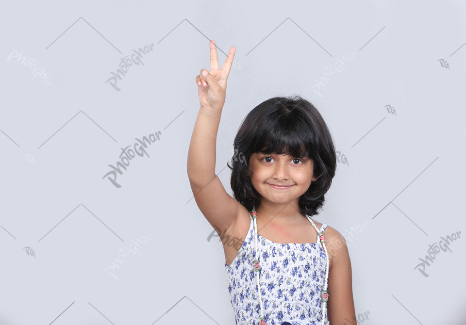 beautiful girl showing victory sign