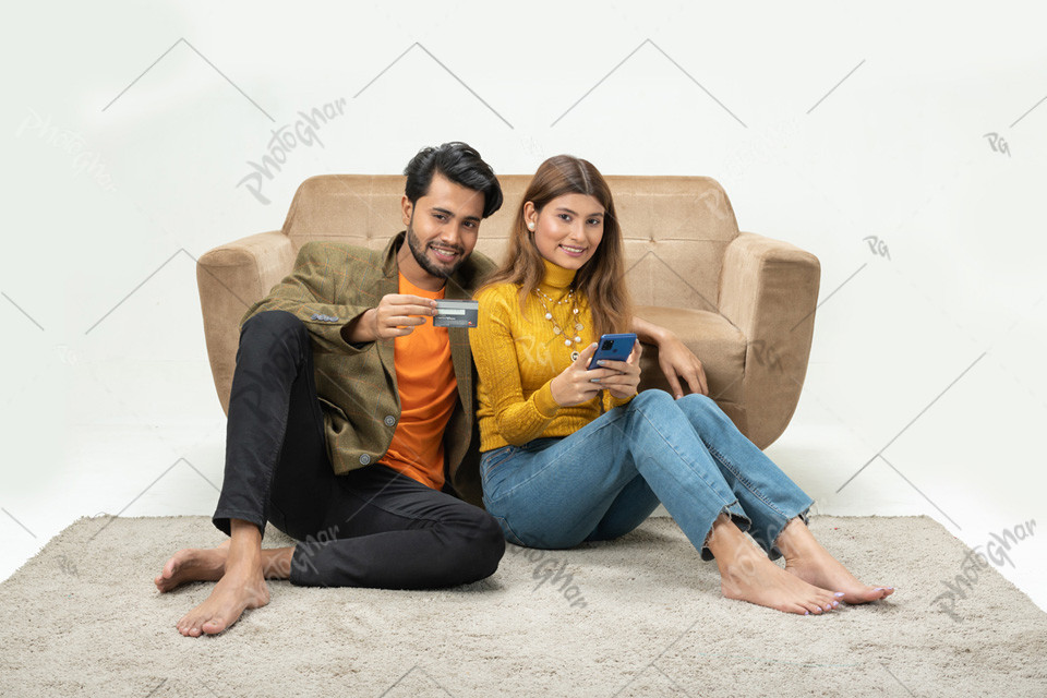 beautiful smart couple using credit card