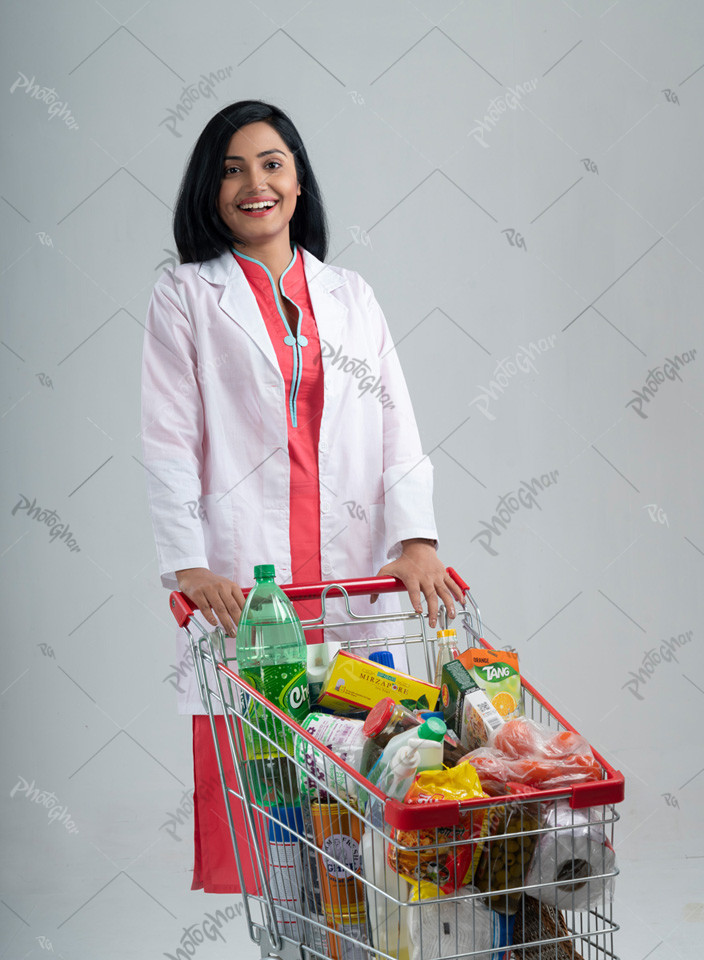 beautiful woman doctor of Bangladesh standing with shopping cart