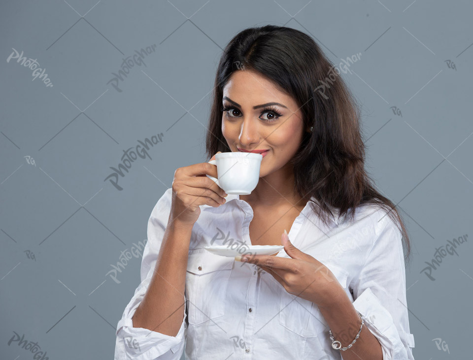 beautiful young girl having tea