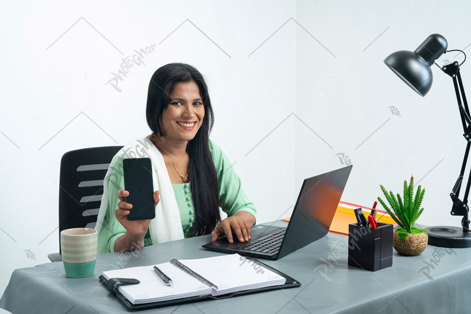 businesswoman showing mobile screen