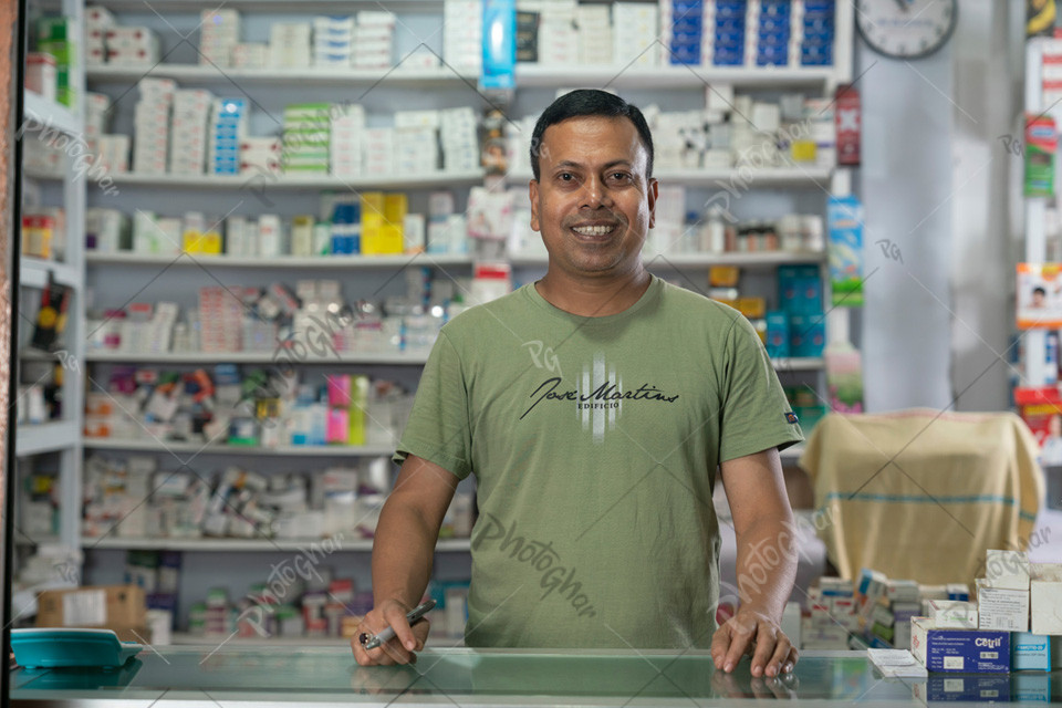 confident male sales manager in pharmacy store