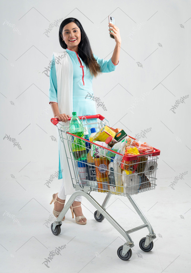 excited young woman shopping cart and talking video call