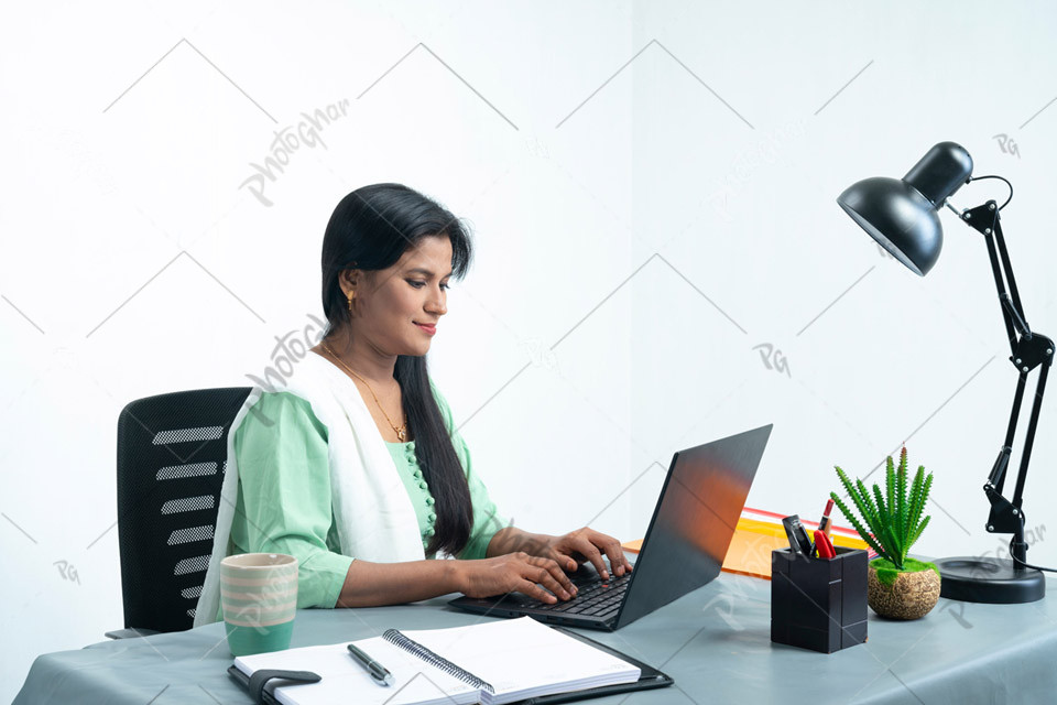 female Worker Using Laptop