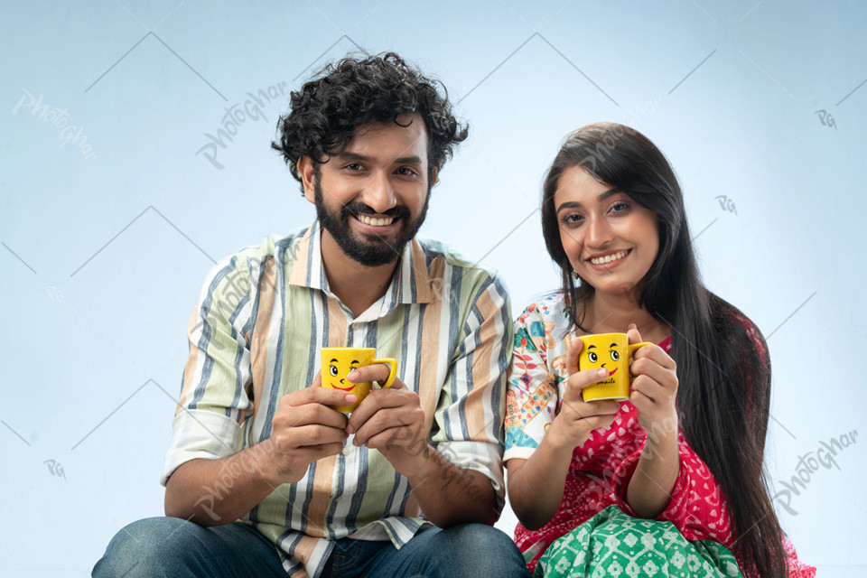 happy Bengali couple drinking tea