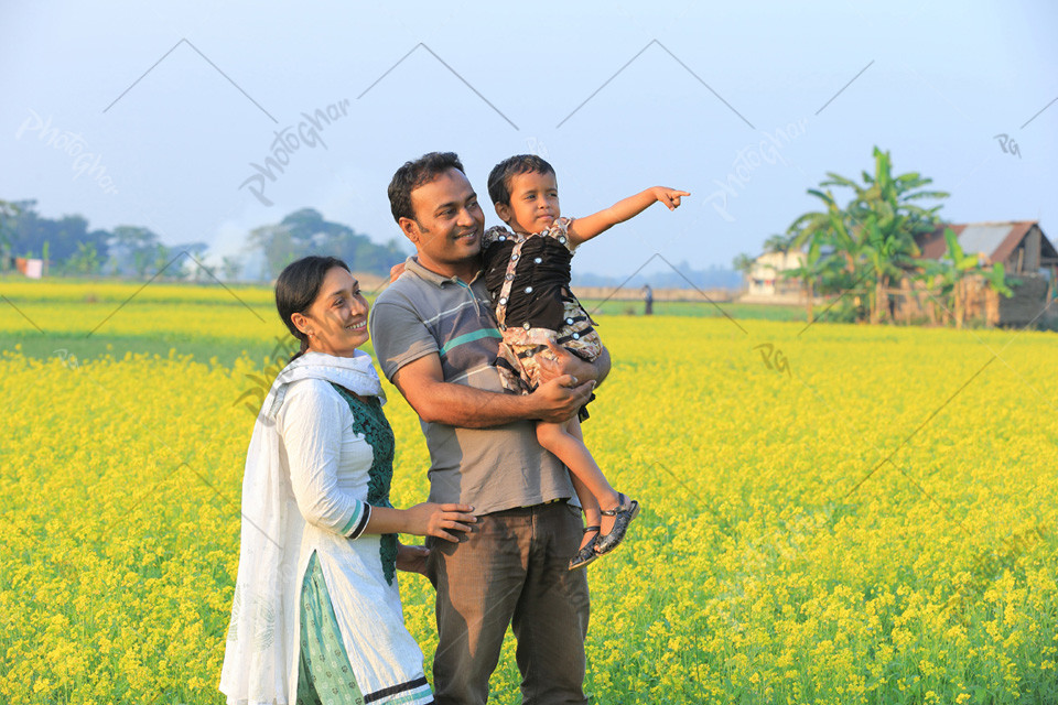 happy family in mustard field